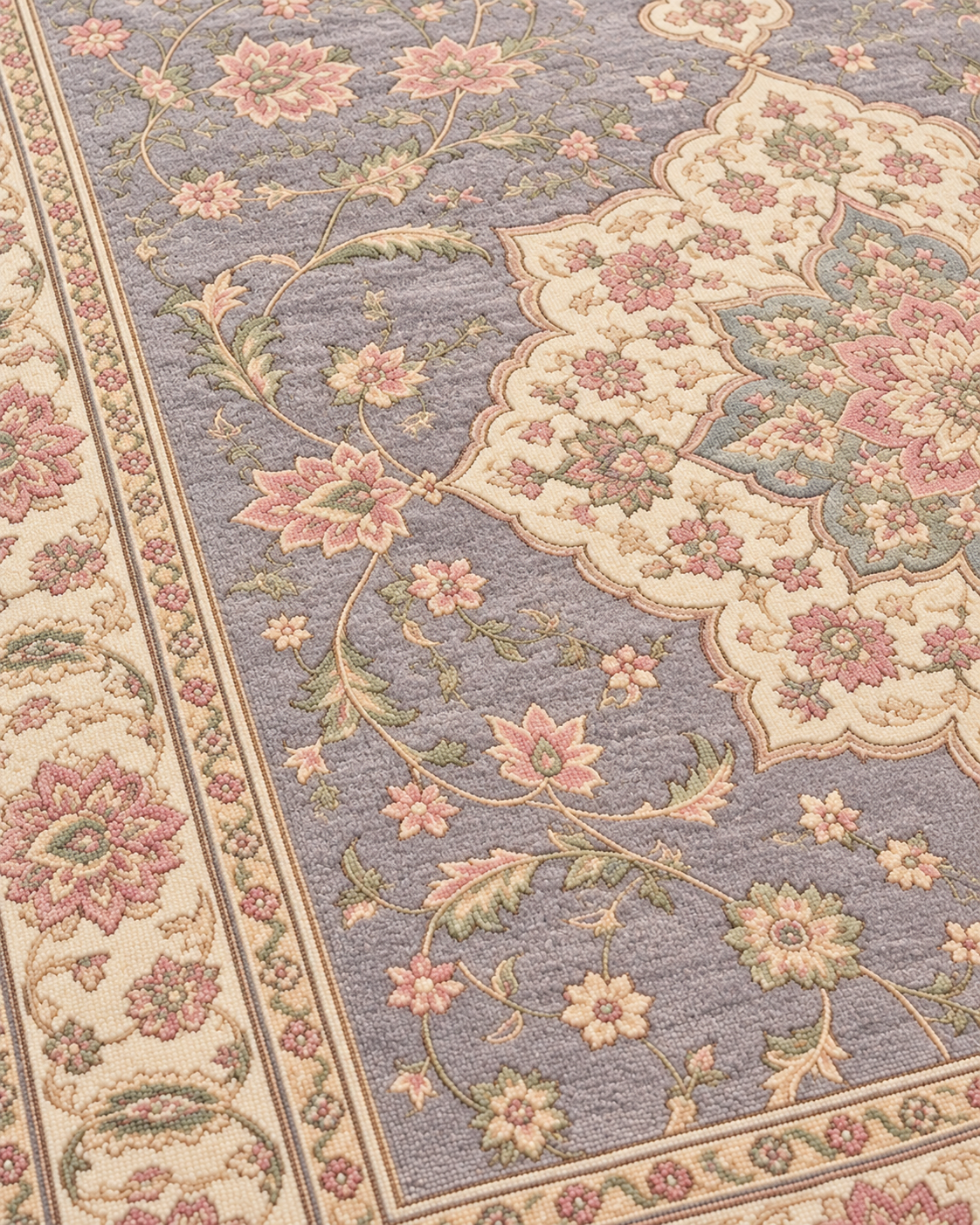 Close-up of H02 Tabriz Medallion showing blush and sage flowers against the lavender-grey field in knotted wool
