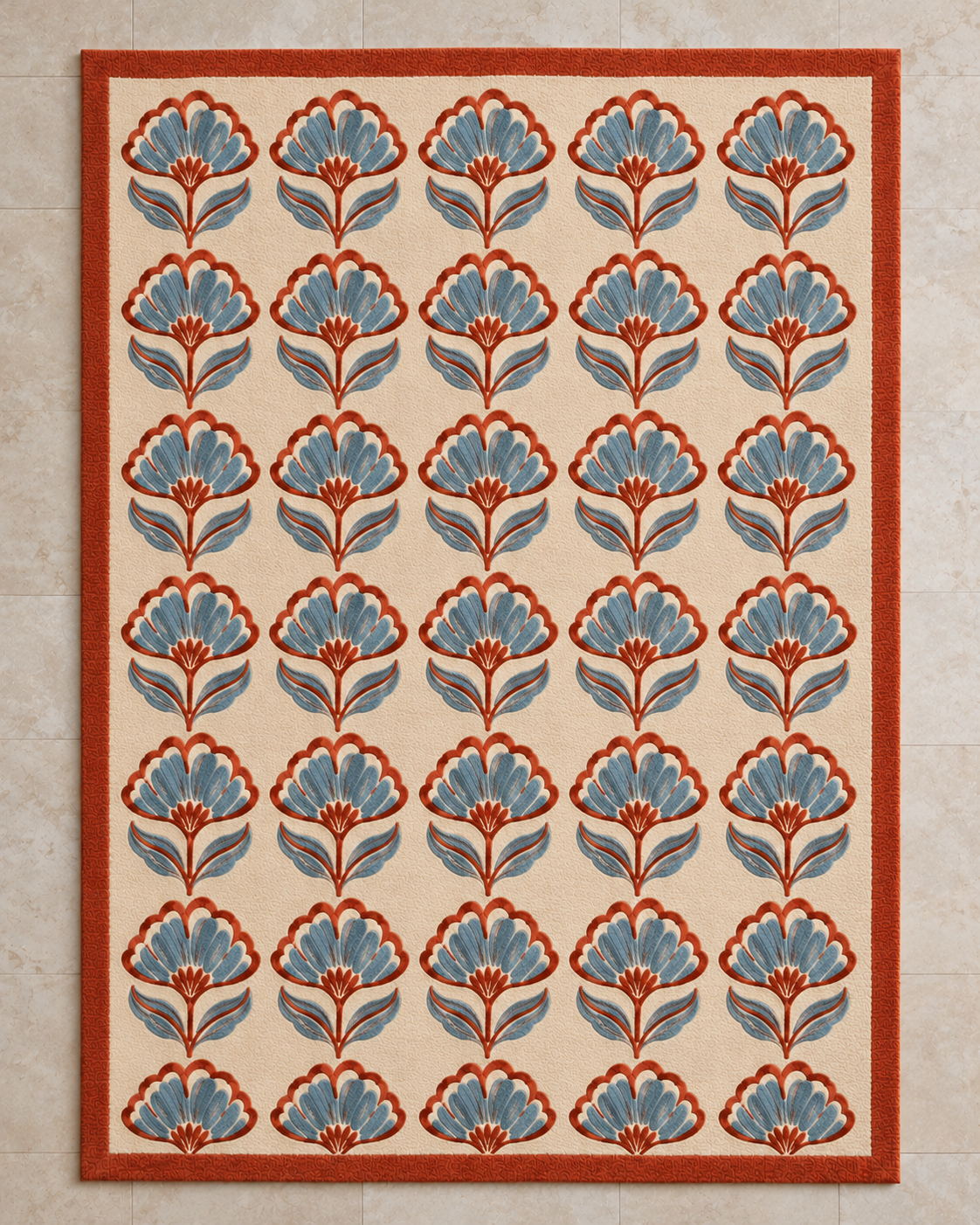 H05 Jaipur Block rug from above, rows of small block-print flowers in rust and powder blue on cream with a rust border